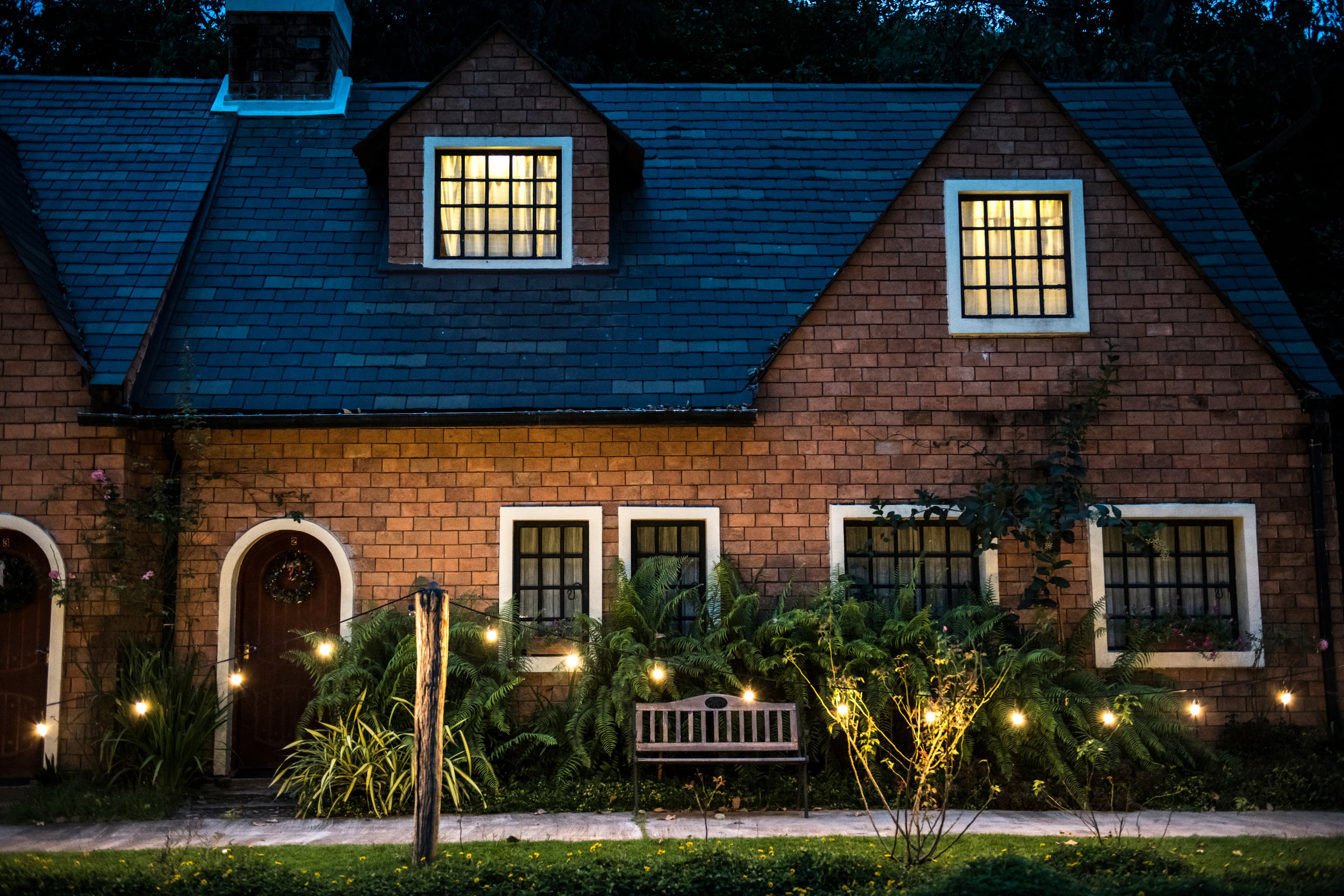 Red Brick House with Decorative Lights